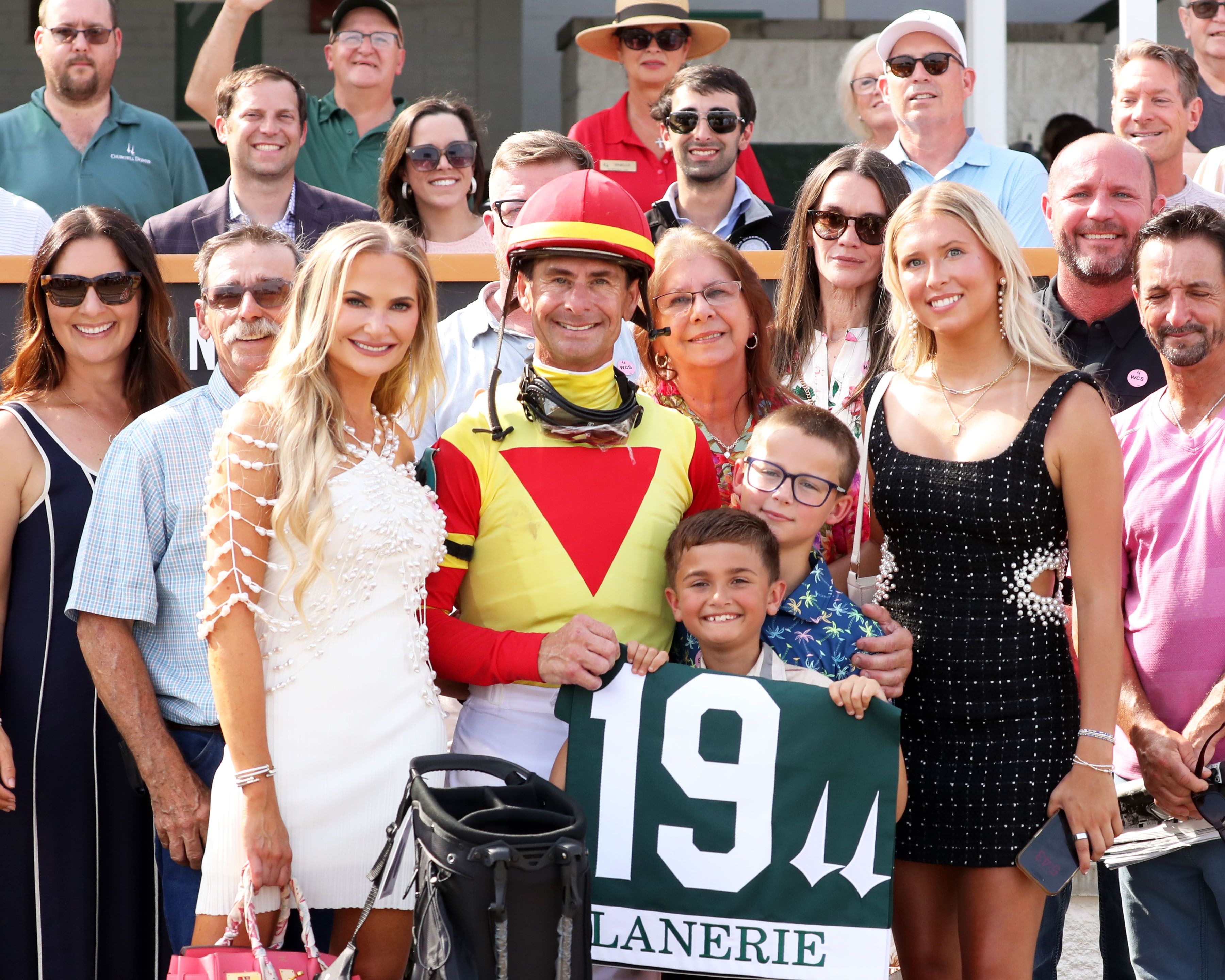 Corey Lanerie flanked by family and friends including the Churchill Downs jockey colony