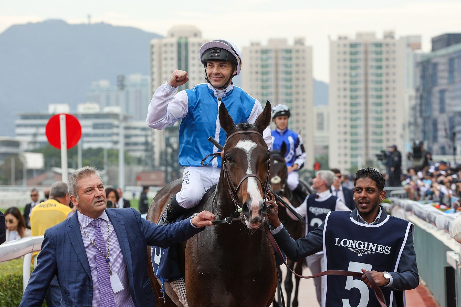 Maxime Guyon celebrates aboard Hong Kong Vase (G1) victor Sosie
